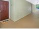 Apartment building hallway with a brown door at 12602 Crest Springs Ln # 1314, Orlando, FL 32828