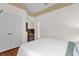 Comfortable bedroom with wood floors and double door closet at 13055 Lake Live Oak Dr, Orlando, FL 32828