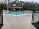 Inviting community pool with a covered patio area at 13055 Lake Live Oak Dr, Orlando, FL 32828