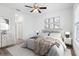 This bedroom features a ceiling fan, a soft carpet and a neutral color palette, creating a calm and inviting atmosphere at 13781 Sw 33Rd Ter, Ocala, FL 34473