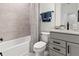 Clean bathroom with a shower/tub combo and gray vanity at 15100 Grove Lake Dr, Winter Garden, FL 34787