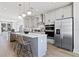 Modern kitchen with stainless steel appliances and gray cabinets at 15100 Grove Lake Dr, Winter Garden, FL 34787