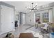 Spacious living room with large windows and a stylish desk area at 15100 Grove Lake Dr, Winter Garden, FL 34787