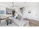 Open living room with sectional sofa and staircase view at 15100 Grove Lake Dr, Winter Garden, FL 34787