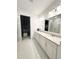 Elegant bathroom with double vanity and walk-in shower at 17795 Blazing Star Cir, Clermont, FL 34714