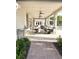 Community patio with covered seating, tables, and brick walkways at 17795 Blazing Star Cir, Clermont, FL 34714