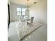 Bright dining room with a view and modern chandelier at 17795 Blazing Star Cir, Clermont, FL 34714