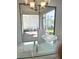 Dining room with view of backyard lanai from sliding glass doors at 17795 Blazing Star Cir, Clermont, FL 34714