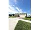 One-story house with a two-car garage and a nicely landscaped front yard at 17795 Blazing Star Cir, Clermont, FL 34714