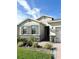 One-story house with gray shutters, stone accents, and a two-car garage at 17795 Blazing Star Cir, Clermont, FL 34714