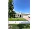 One story house with gray shutters, stone accents, and a two-car garage at 17795 Blazing Star Cir, Clermont, FL 34714