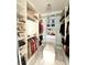 Custom designed walk-in closet with plenty of storage at 17795 Blazing Star Cir, Clermont, FL 34714