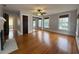 Main bedroom with hardwood floors, fireplace and mirrored closet at 2101 Sanford Ave, Sanford, FL 32771