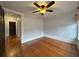 Bright bedroom with hardwood floors and ceiling fan at 2101 Sanford Ave, Sanford, FL 32771