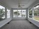 Bright sunroom with ample windows and grey carpet at 2101 Sanford Ave, Sanford, FL 32771