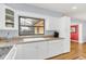 White kitchen with sink and view into the backyard at 224 Ridgewood St, Altamonte Springs, FL 32701