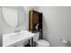Clean bathroom with pedestal sink, toilet, and linen storage at 2909 Econ Landing Blvd, Orlando, FL 32825