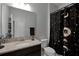 Bathroom features granite countertop and black vanity at 2909 Econ Landing Blvd, Orlando, FL 32825