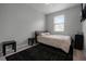 Bedroom with window, carpet flooring, and a simple setup at 2909 Econ Landing Blvd, Orlando, FL 32825