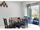 Dining area with six chairs and sliding glass doors leading to a patio at 2909 Econ Landing Blvd, Orlando, FL 32825