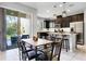 Kitchen and dining area with breakfast bar and access to the back patio at 2909 Econ Landing Blvd, Orlando, FL 32825