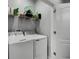 Laundry room with washer, dryer, and shelving at 2909 Econ Landing Blvd, Orlando, FL 32825