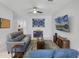 Living room with comfortable seating and large screen TV at 2909 Econ Landing Blvd, Orlando, FL 32825