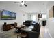 Open living room with leather sofas and view into kitchen area at 2909 Econ Landing Blvd, Orlando, FL 32825