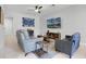 Spacious living room featuring comfortable seating and a large TV at 2909 Econ Landing Blvd, Orlando, FL 32825