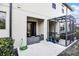 Back patio with screened enclosure and seating area at 2909 Econ Landing Blvd, Orlando, FL 32825