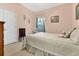 Light and airy bedroom with a comfortable bed and rocking chair at 3683 Half Moon Dr, Orlando, FL 32812