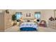 Charming bedroom with a floral bedspread and built in wardrobe at 3683 Half Moon Dr, Orlando, FL 32812