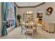 Bright dining area with large windows and a charming table setting at 3683 Half Moon Dr, Orlando, FL 32812