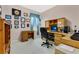 Home office with wood desk, computer, and built-in shelves at 3683 Half Moon Dr, Orlando, FL 32812
