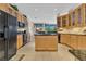 Spacious kitchen with wood cabinets, granite counters and black appliances at 3683 Half Moon Dr, Orlando, FL 32812