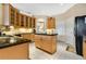 Kitchen with an island, granite countertops, and ample cabinet space at 3683 Half Moon Dr, Orlando, FL 32812