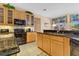 Well-equipped kitchen featuring granite counters and ample cabinetry at 3683 Half Moon Dr, Orlando, FL 32812