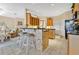 Kitchen features a breakfast bar with tile detailing and light-colored cabinets at 3683 Half Moon Dr, Orlando, FL 32812