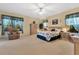 Spacious main bedroom with ample light and a floral comforter at 3683 Half Moon Dr, Orlando, FL 32812