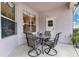Covered patio with table and chairs, offering outdoor dining at 3683 Half Moon Dr, Orlando, FL 32812