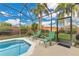 Relaxing screened pool area with lounge chairs at 3683 Half Moon Dr, Orlando, FL 32812