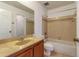 Bathroom with beige tile and wood vanity at 4017 Versailles Dr # 4017F, Orlando, FL 32808