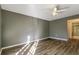 Bedroom with gray walls and wood-look floors at 4017 Versailles Dr # 4017F, Orlando, FL 32808