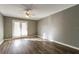 Bedroom with gray walls and wood-look floors at 4017 Versailles Dr # 4017F, Orlando, FL 32808