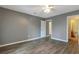 Bedroom with gray walls and wood-look floors at 4017 Versailles Dr # 4017F, Orlando, FL 32808