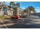 Parking lot with cars parked in front of building at 4017 Versailles Dr # 4017F, Orlando, FL 32808