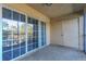 Screened balcony with sliding glass doors at 4017 Versailles Dr # 4017F, Orlando, FL 32808