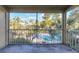 Screened balcony overlooking pool and trees at 4017 Versailles Dr # 4017F, Orlando, FL 32808