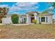 One-story house with solar panels, landscaped yard, and a welcoming entrance at 431 Pheasant Dr, Haines City, FL 33844