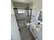 Updated bathroom with white vanity, hexagon floor tile, and walk-in shower at 620 Heraldo Ct, Kissimmee, FL 34758